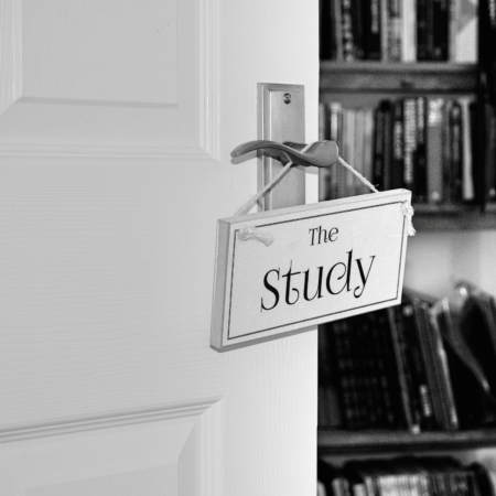 monochrome wood sign on door with the study