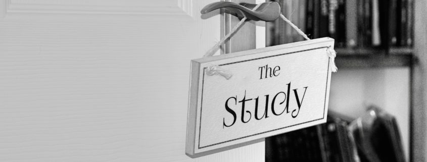 monochrome wood sign on door with the study