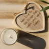 top view of candle and hanging heart decoration with a happy soul quote on home of juniper