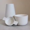 white earternware vase, tea-bowl and tea-strainer by sue pryke for home of juniper