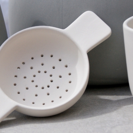 Tea bowl and tea-strainer in Stone by Sue Pryke for La Juniper