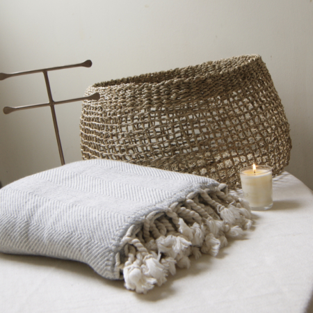 grey wool cotton throw basket candle and brass jewellery stand