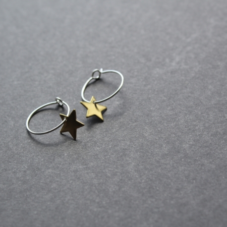 silver earring hoop with shiny brass star charm