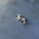 silver studs shaped like roses